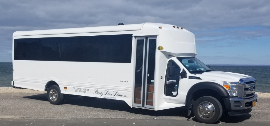 26-passenger white party bus.